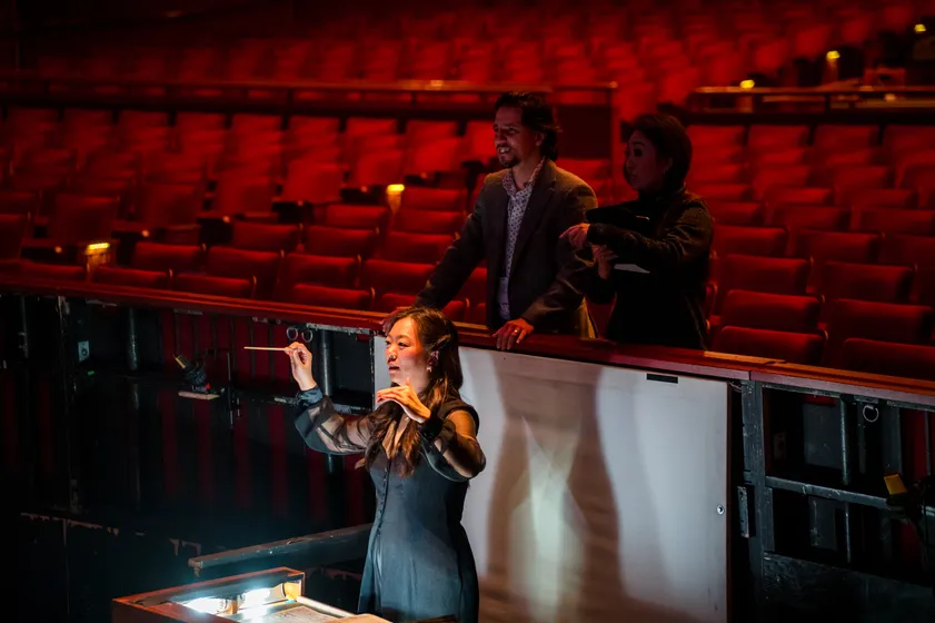 Orchestra conductor mid-performance